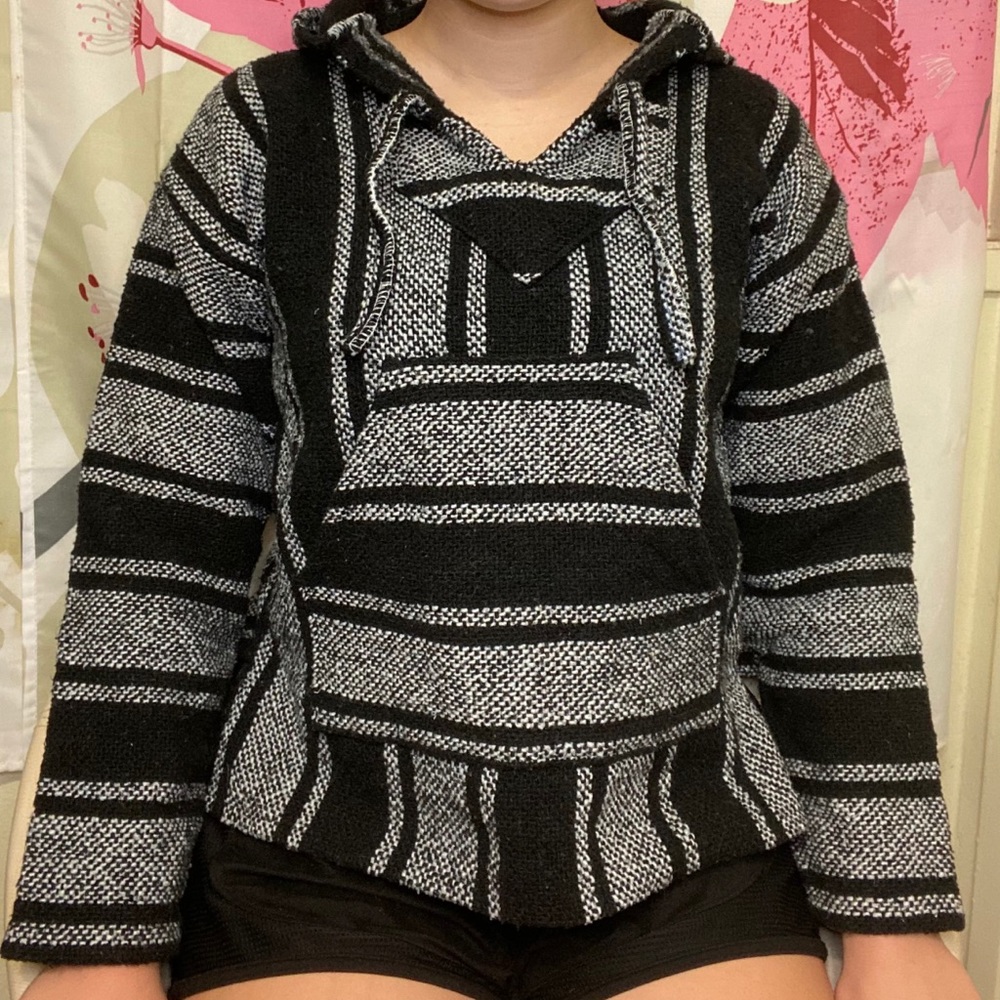 A black and white poncho hoodie